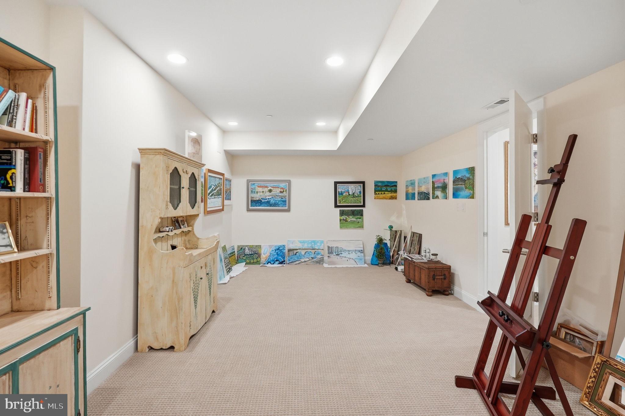 10708 Lockland Road Potomac, MD 20854 - Photo 53 of 69 a view of a hallway with workspace and wooden floor