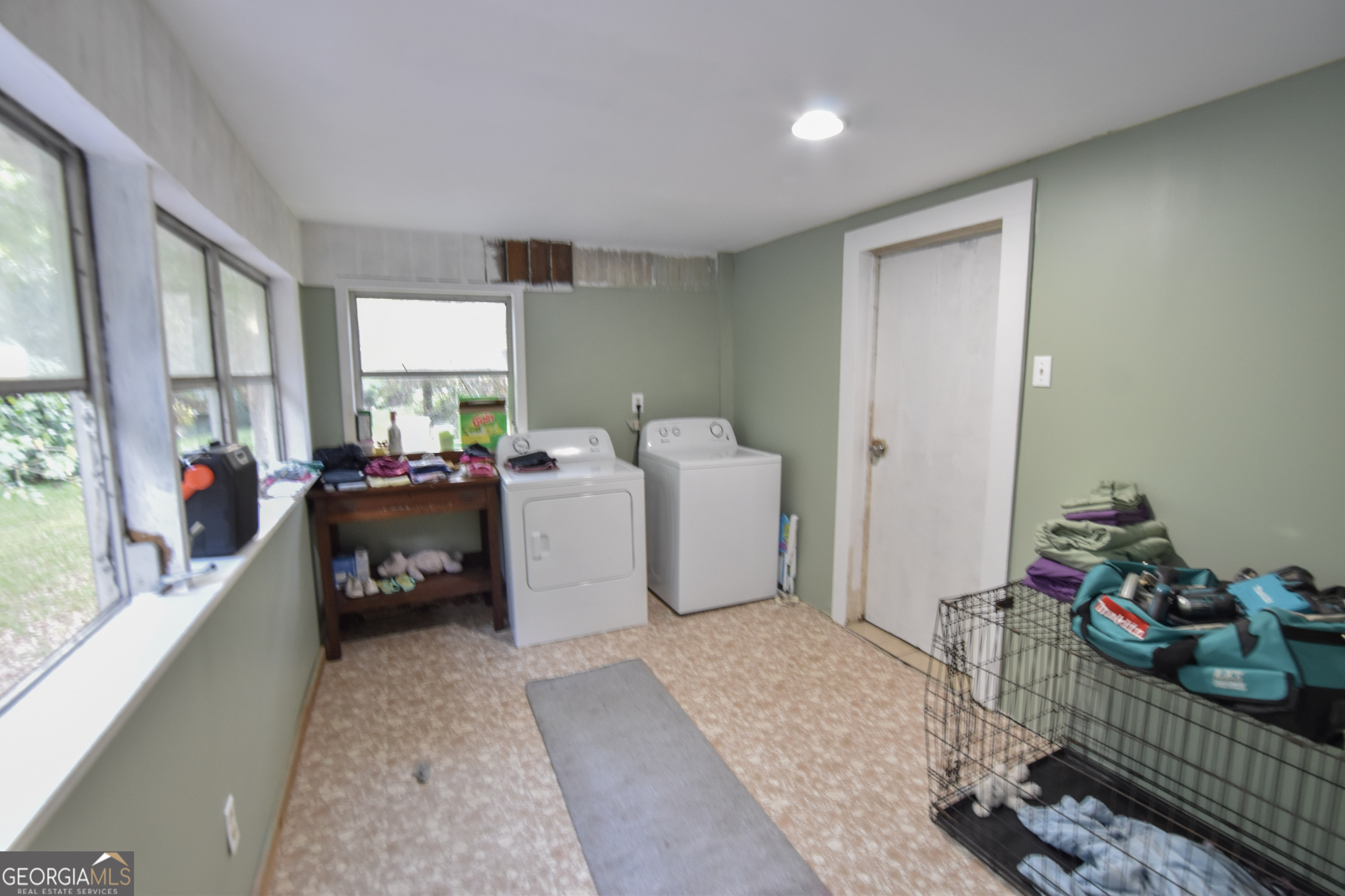 908 East McCarty Street Sandersville, GA 31082 - Photo 15 of 20 a bed room with furniture and a window