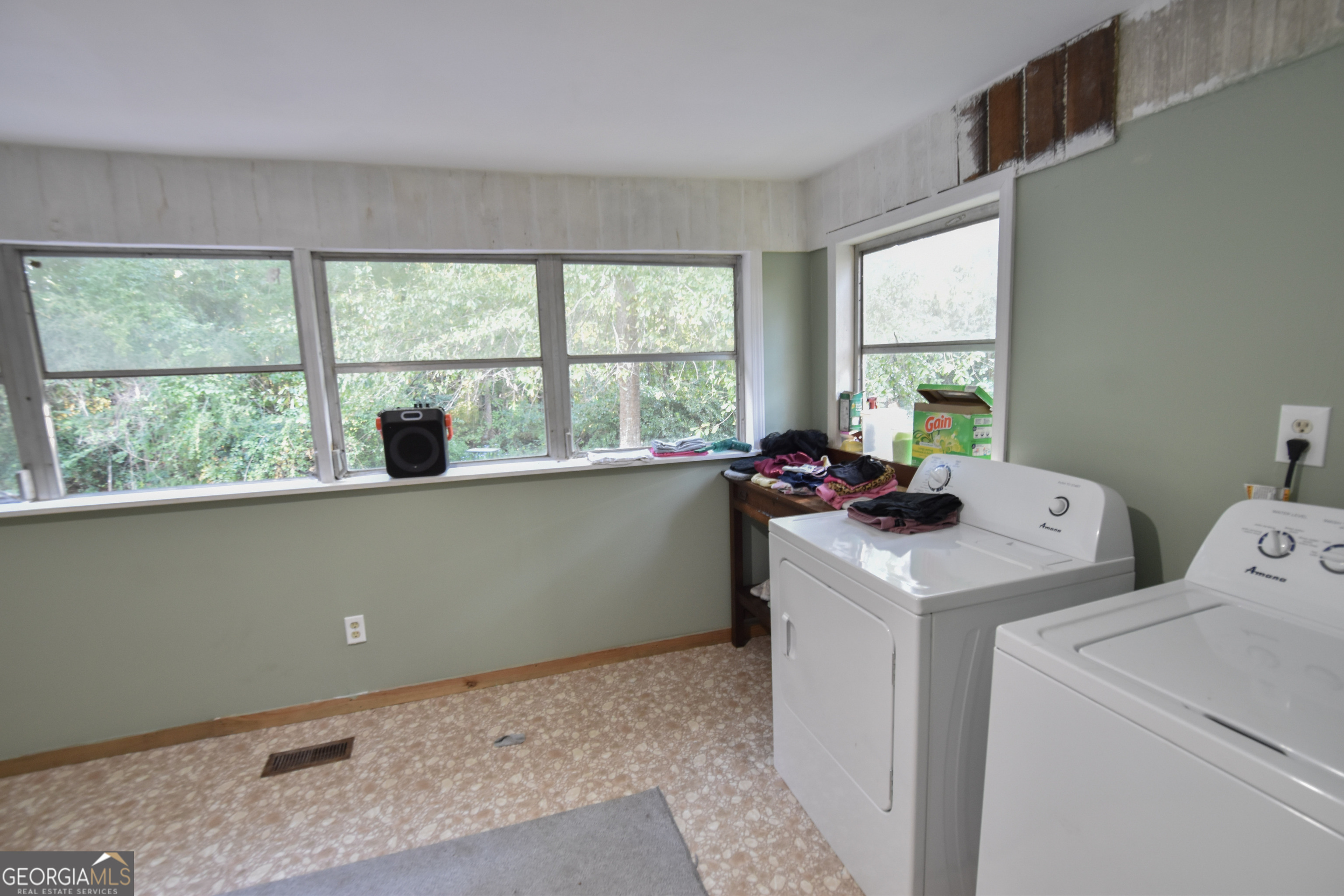 908 East McCarty Street Sandersville, GA 31082 - Photo 17 of 20 a view of storage and utility room with a window