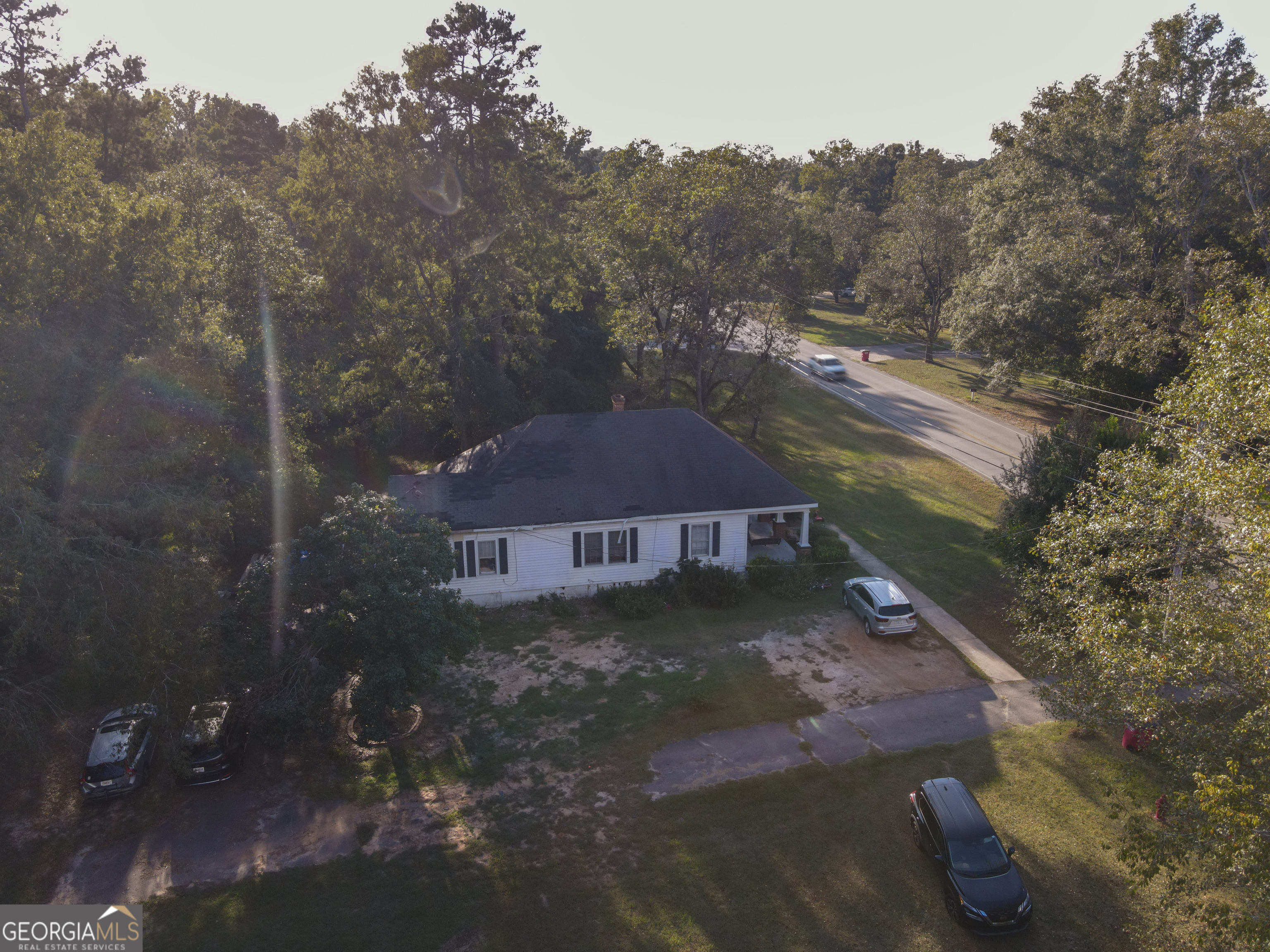 908 East McCarty Street Sandersville, GA 31082 - Photo 19 of 20 a view of a house with a yard