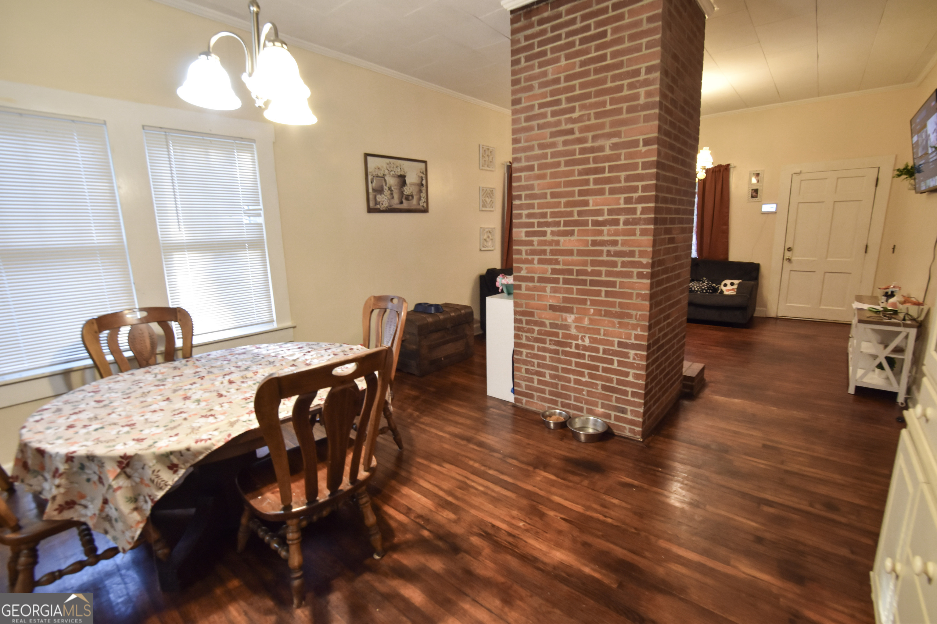 908 East McCarty Street Sandersville, GA 31082 - Photo 5 of 20 a view of a dining room with furniture and wooden floor