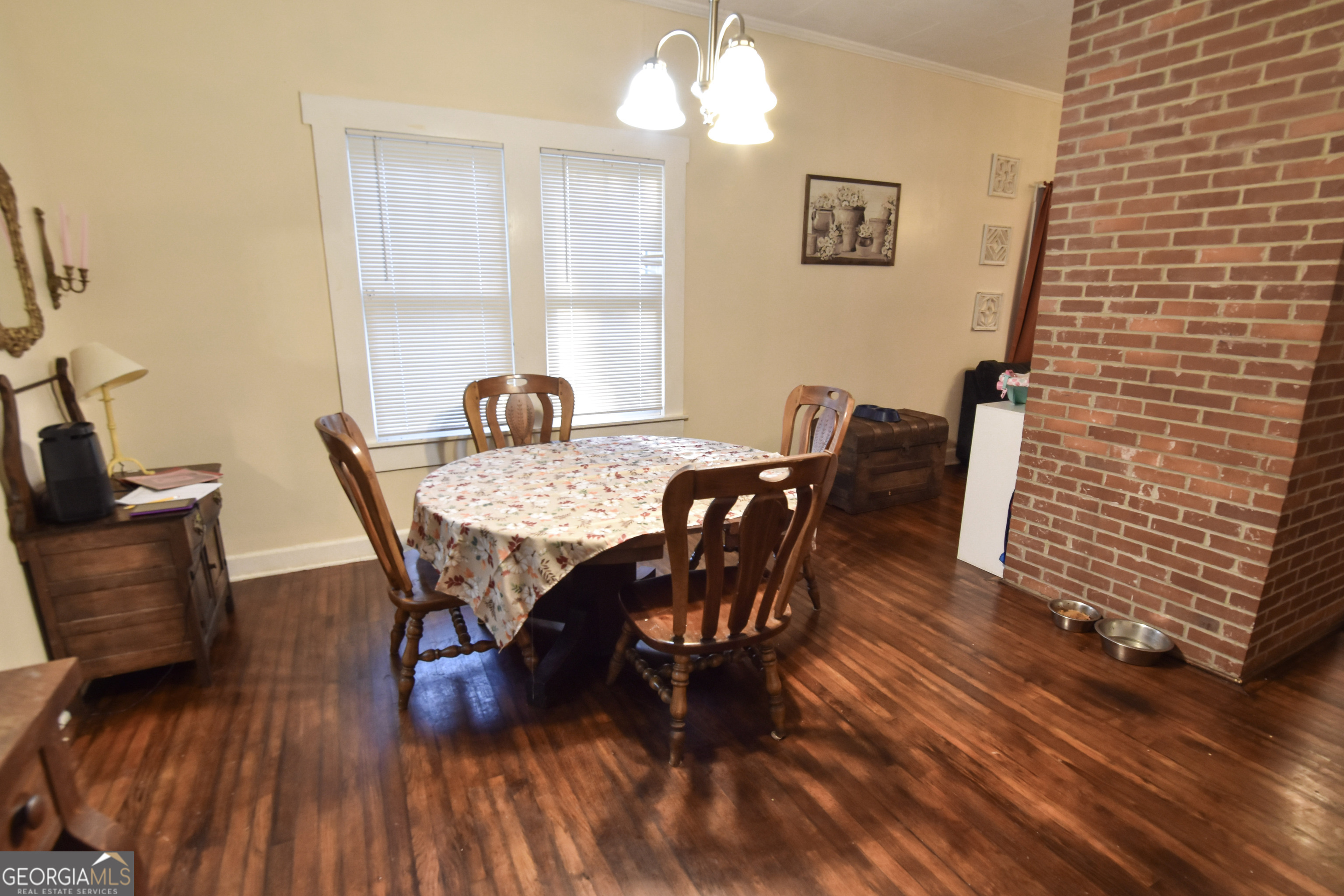 908 East McCarty Street Sandersville, GA 31082 - Photo 6 of 20 a view of a dining room with furniture and wooden floor