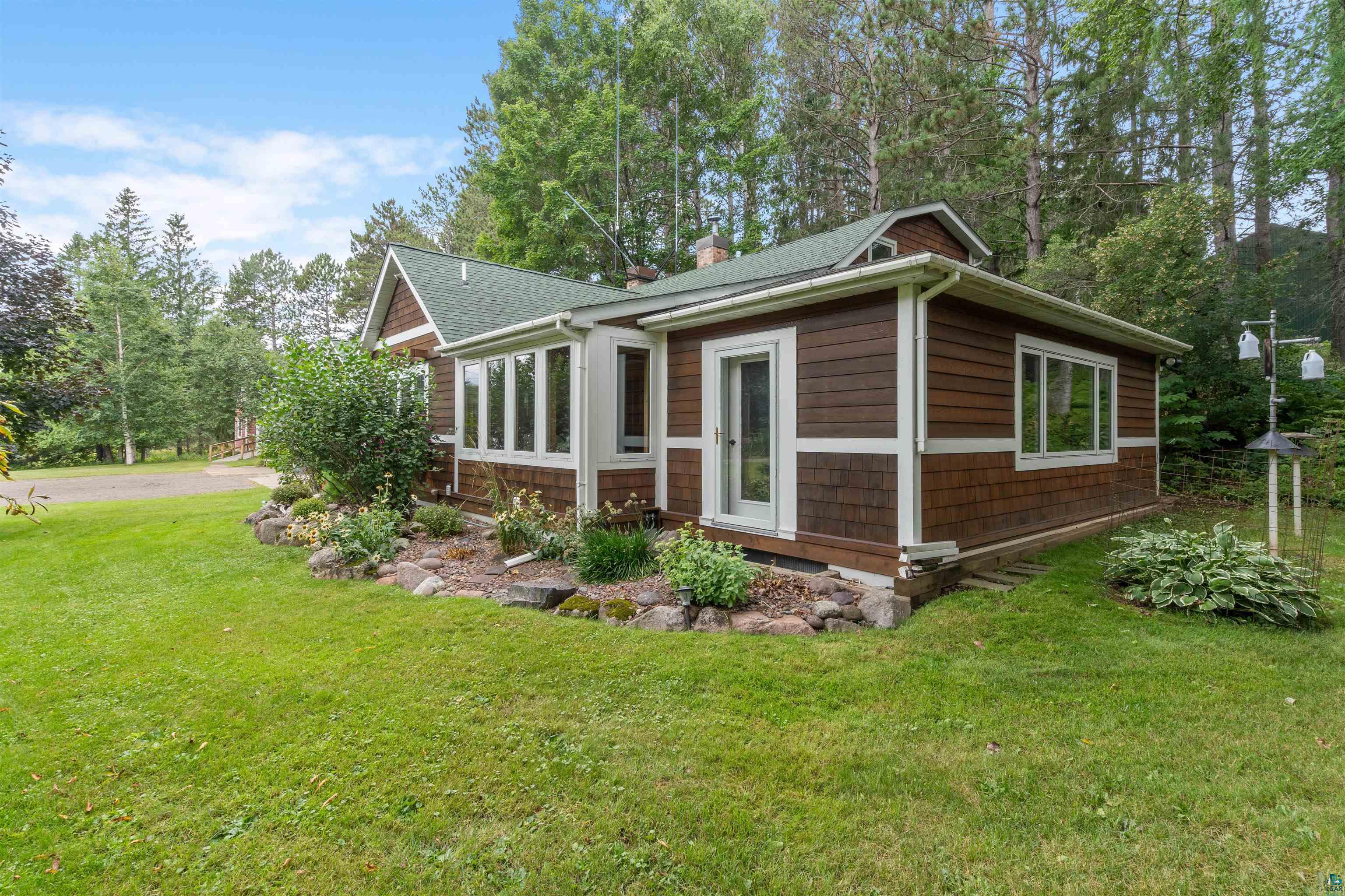 4793 Anderson Road Hermantown, MN 55811 - Photo 35 of 39 Brown shake siding exterior with white trim