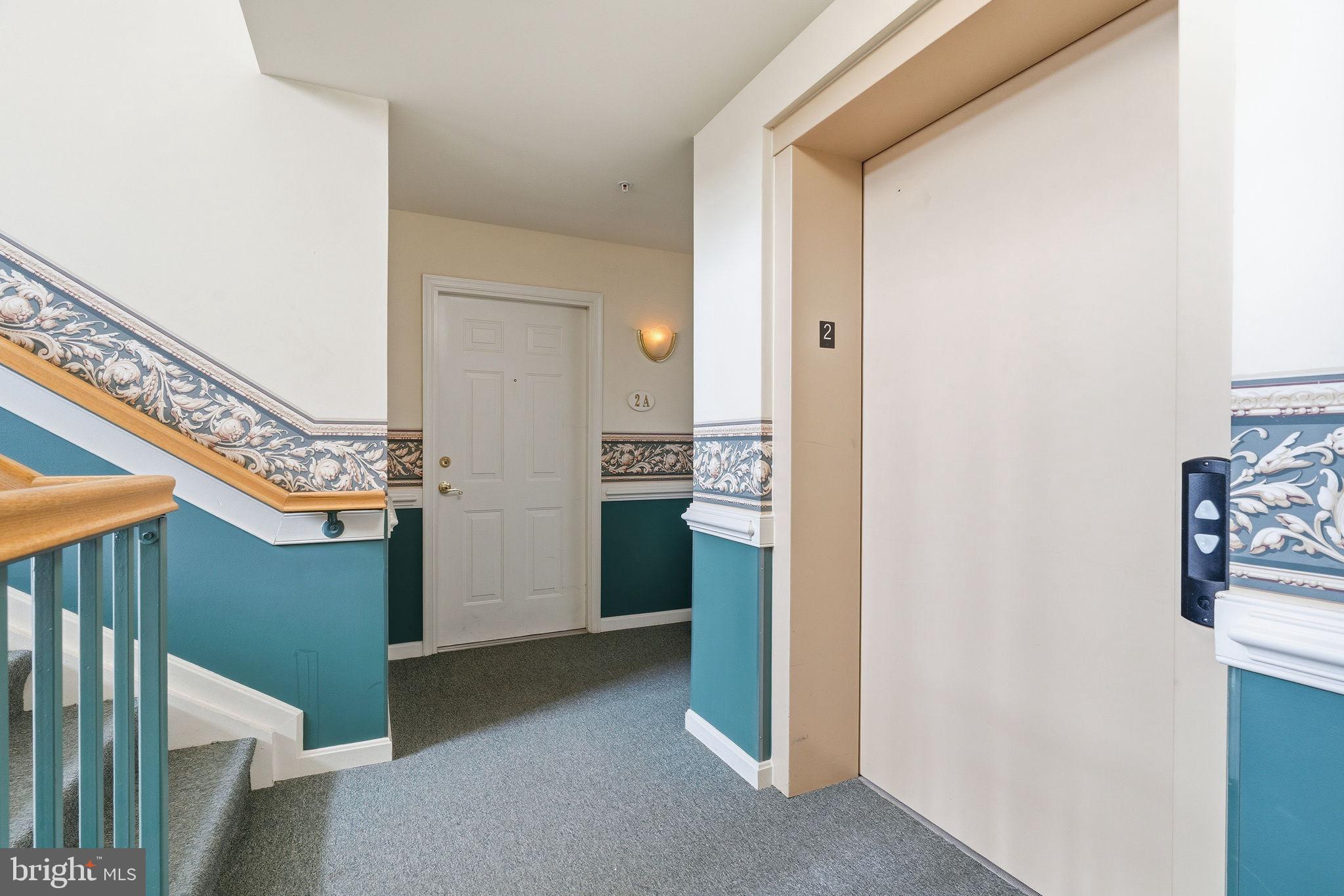 2503 Coleridge Drive, Unit 2A Frederick, MD 21702 - Photo 31 of 42 Elevator and Front Door