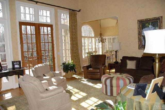 Great living room with built-ins, fireplace, & beautiful windows Other