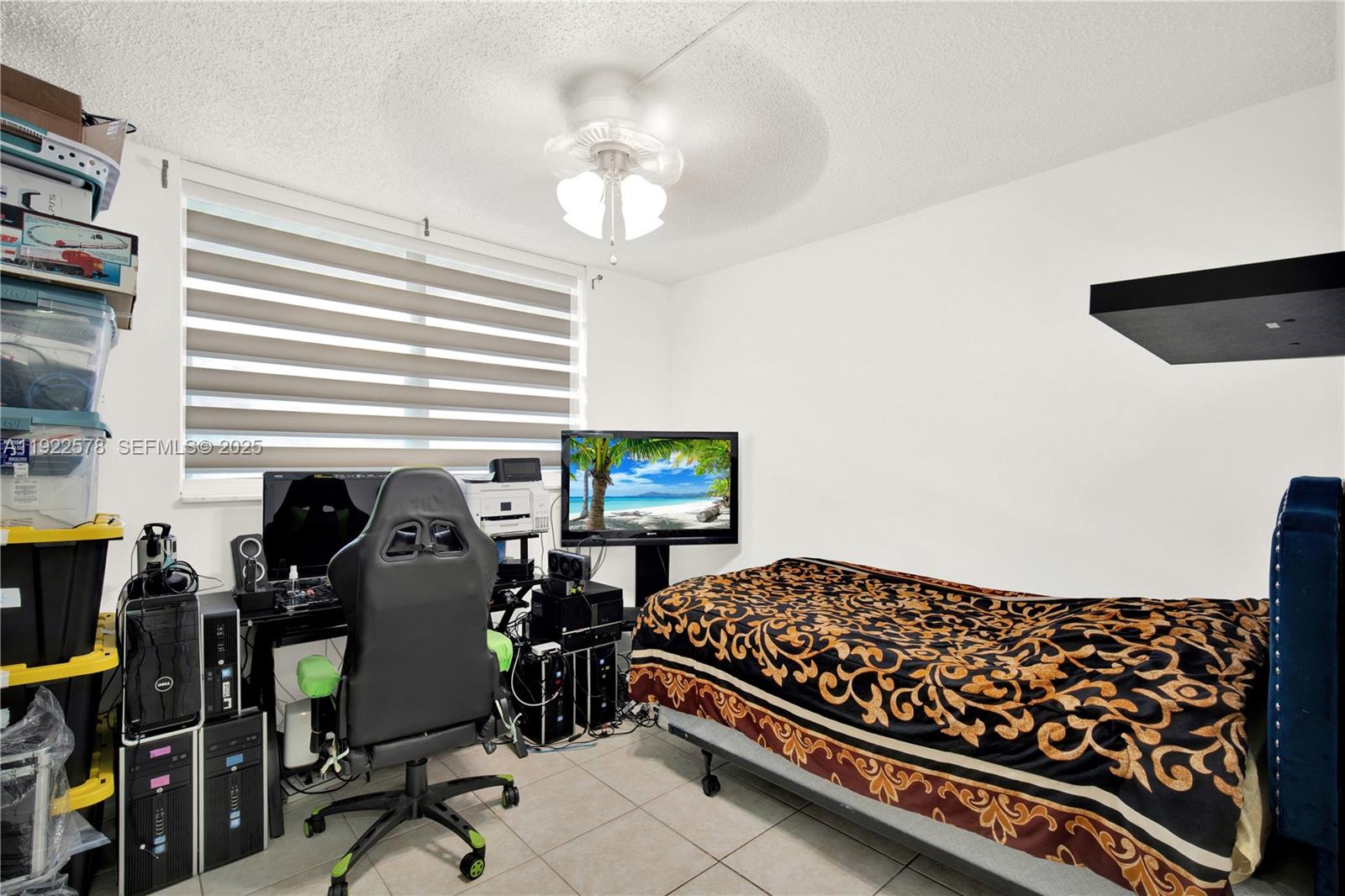 14195 Southwest 87th Street, Unit B115 Miami, FL 33183 - Photo 18 of 22 a bedroom with furniture and a window