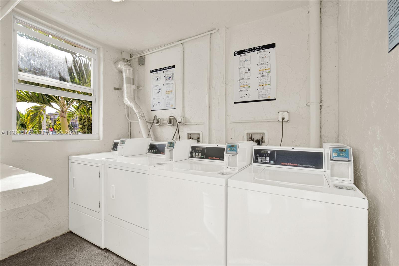 14195 Southwest 87th Street, Unit B115 Miami, FL 33183 - Photo 21 of 22 a room with dryer and washer