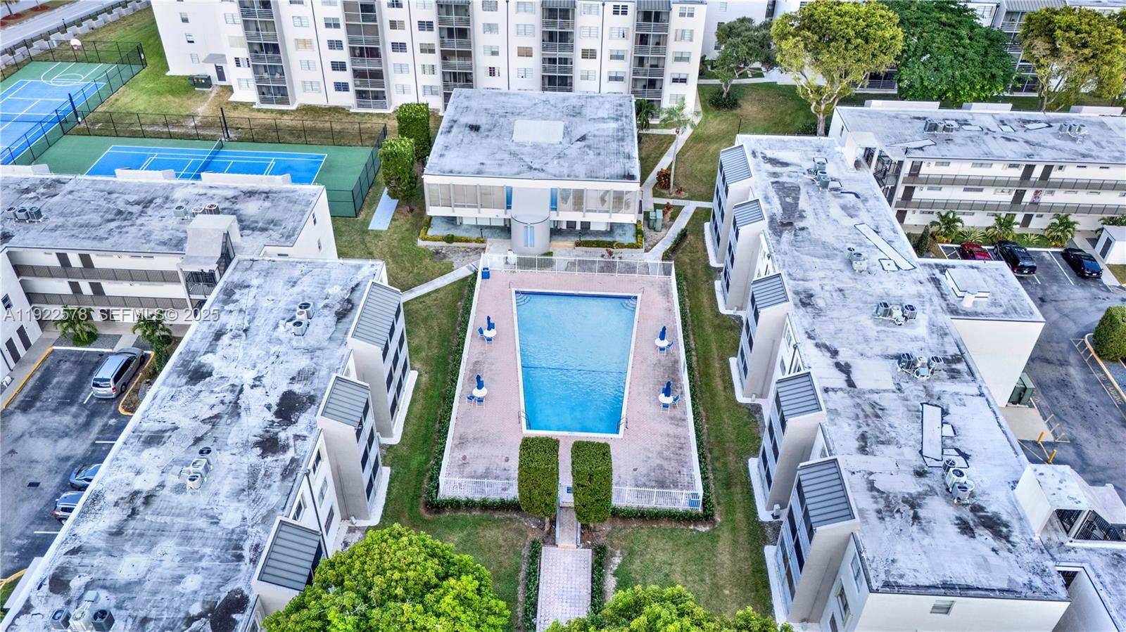 14195 Southwest 87th Street, Unit B115 Miami, FL 33183 - Photo 3 of 22 a aerial view of multi story residential apartment building with yard