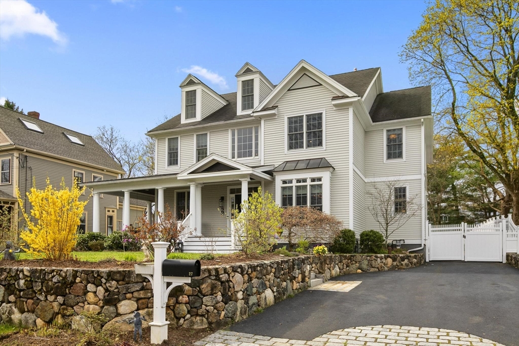 27 Sherman Street Lexington, MA 02420 - Photo 1 of 30 a front view of a house with a yard
