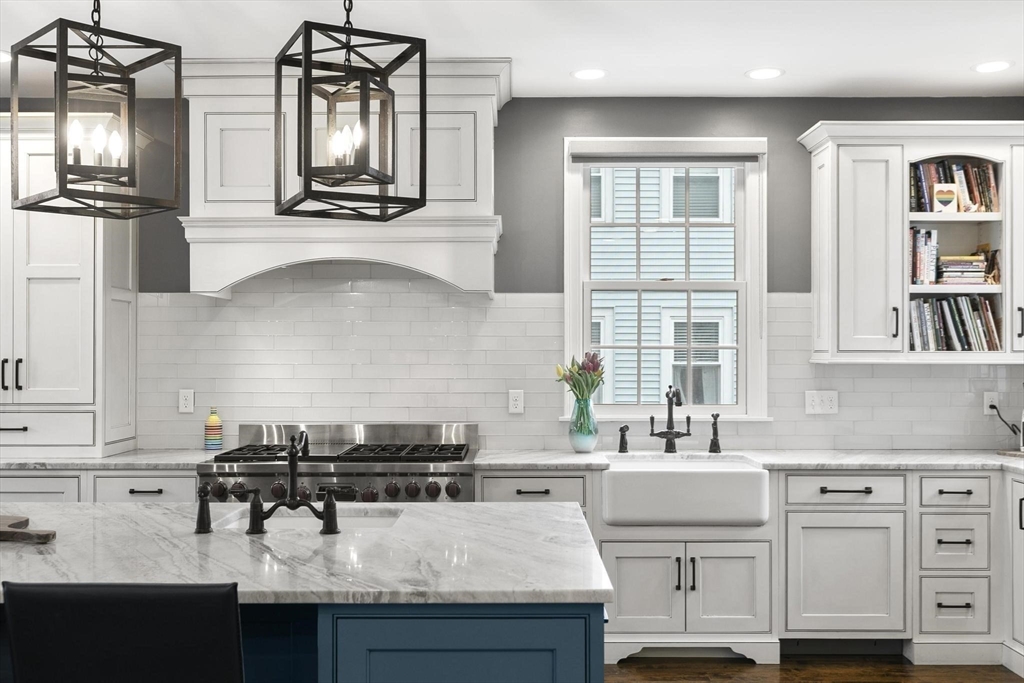 27 Sherman Street Lexington, MA 02420 - Photo 2 of 30 a kitchen with appliances cabinets and a sink