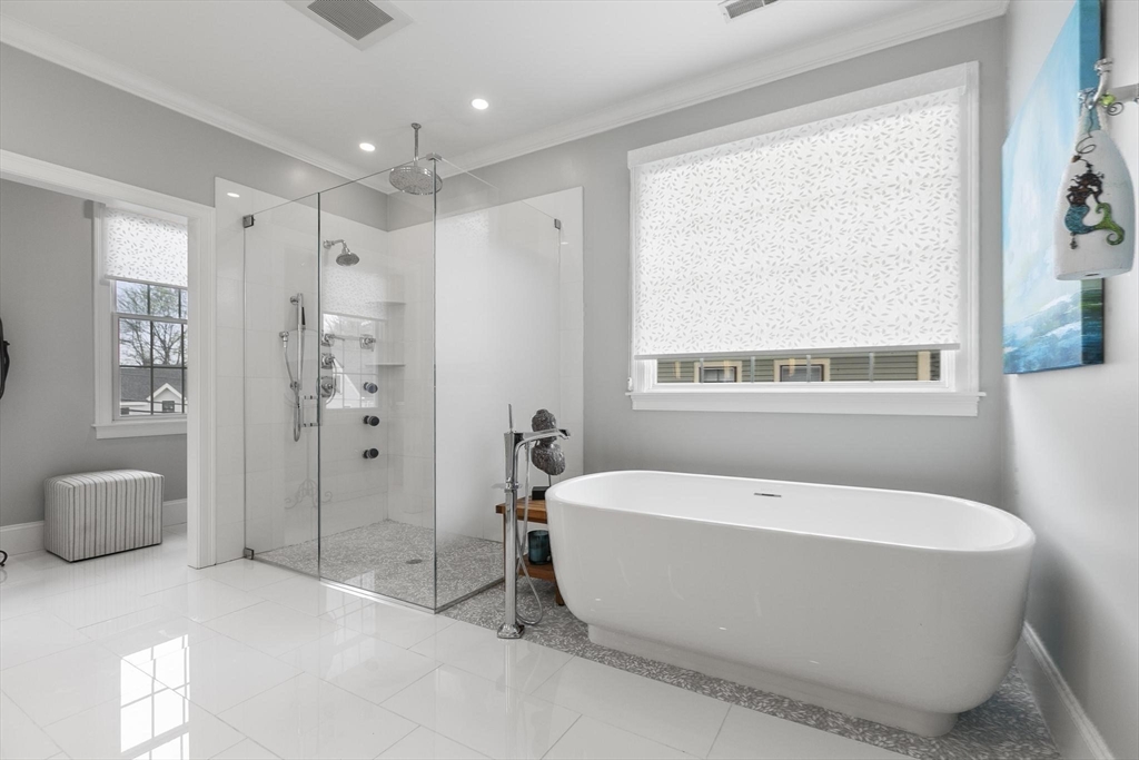 27 Sherman Street Lexington, MA 02420 - Photo 21 of 30 a spacious bathroom with a tub shower and windows