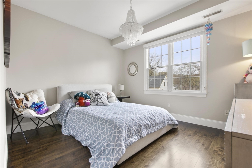 27 Sherman Street Lexington, MA 02420 - Photo 22 of 30 a bedroom with a bed and window