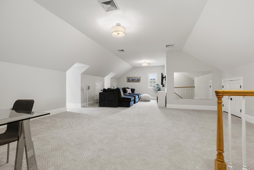 27 Sherman Street Lexington, MA 02420 - Photo 27 of 30 a large room with a table and chairs