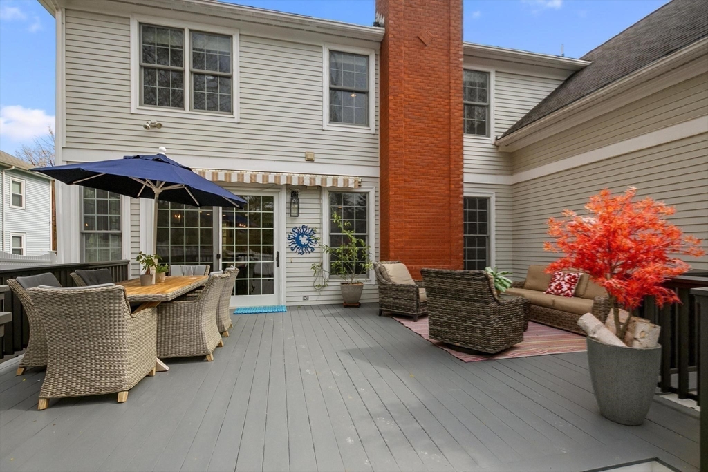 27 Sherman Street Lexington, MA 02420 - Photo 28 of 30 a view of a patio with couches and potted plants