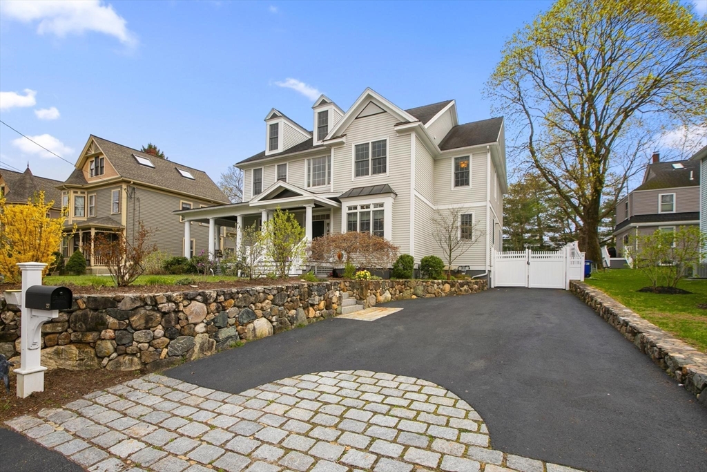 27 Sherman Street Lexington, MA 02420 - Photo 3 of 30 a front view of a house with a yard