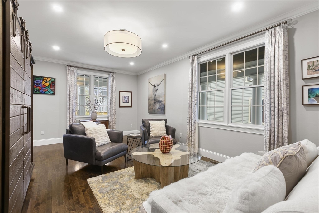 27 Sherman Street Lexington, MA 02420 - Photo 4 of 30 a living room with furniture and a large window