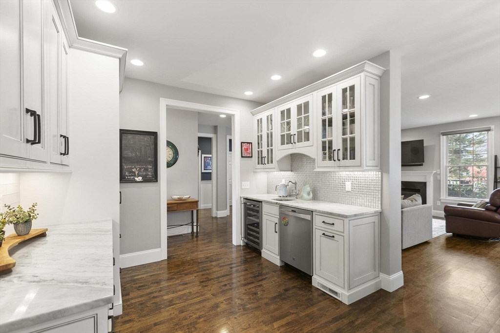 27 Sherman Street Lexington, MA 02420 - Photo 9 of 30 a kitchen with stainless steel appliances granite countertop a stove and cabinets