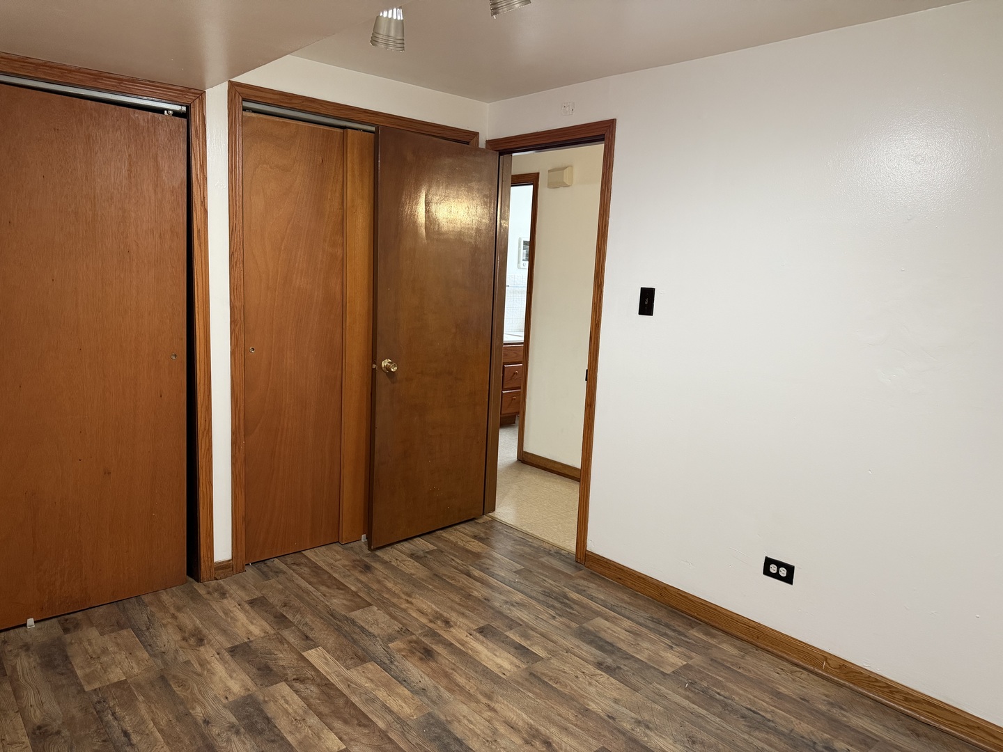 7226 West 63rd Place, Unit 1 Summit, IL 60501 - Photo 7 of 10 a view of an empty room with wooden floor