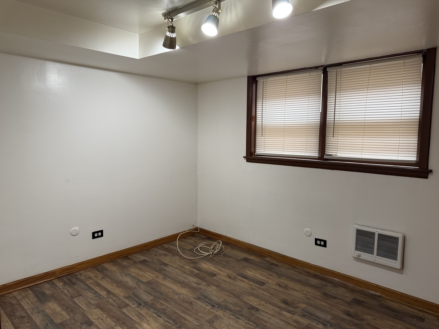 7226 West 63rd Place, Unit 1 Summit, IL 60501 - Photo 8 of 10 a view of empty room with wooden floor and fan