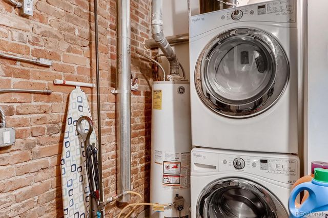 a view of a storage & utility room with dryer and washer