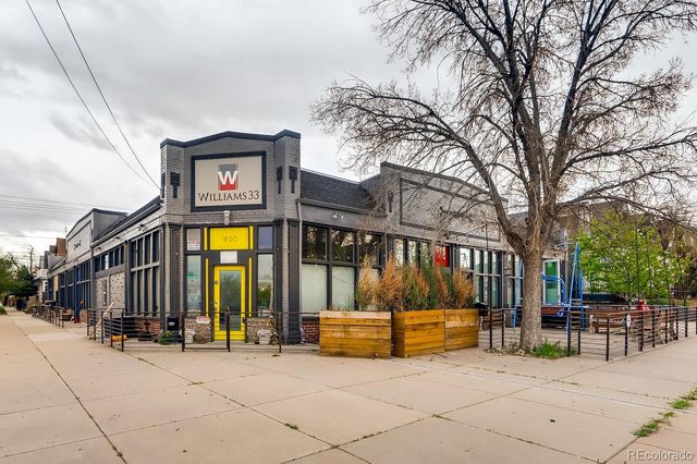 a view of street with large trees