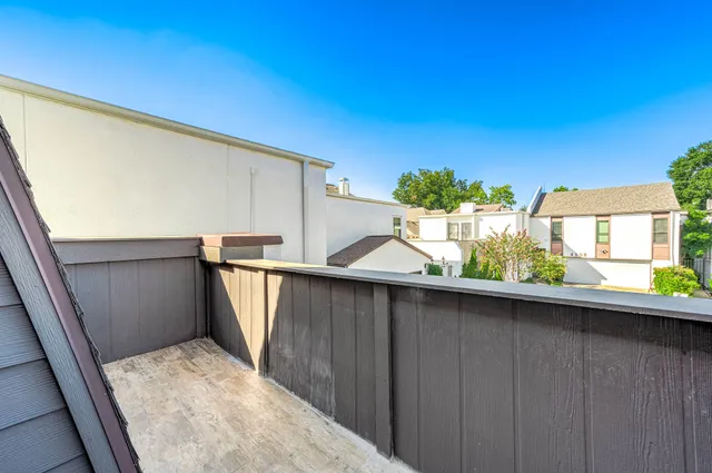 a view of a wooden door of the house