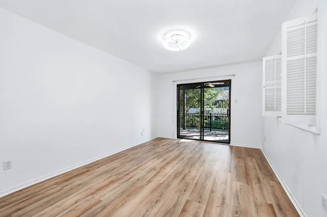 a view of a hardwood floor and a balcony