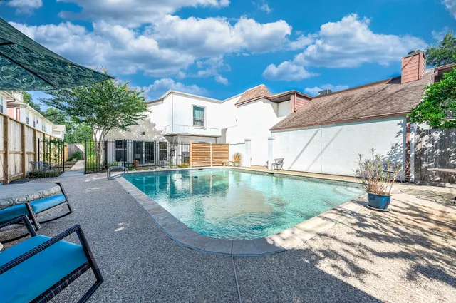 a view of a house with a swimming pool