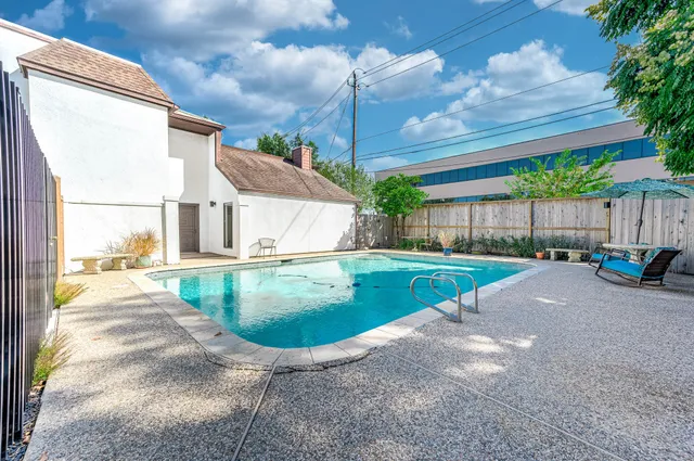 a view of a backyard with a garden and plants