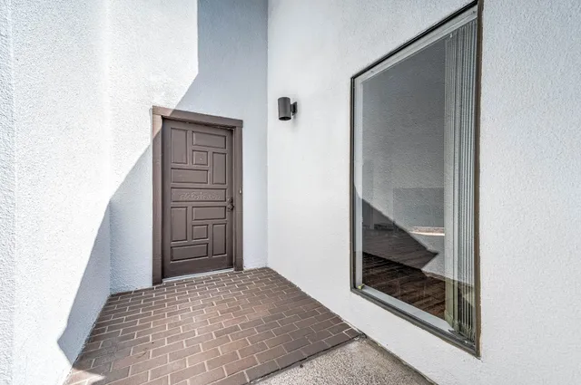 a view of bedroom with wooden floor and closet
