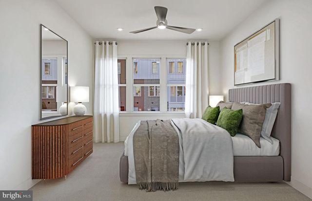 a bed room with a bed and a chandelier