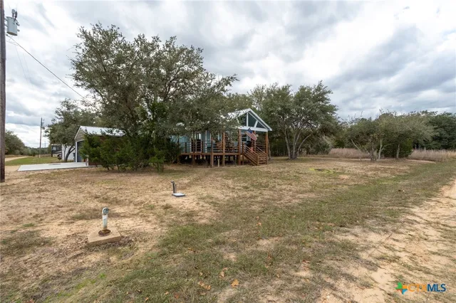 a view of backyard with green space