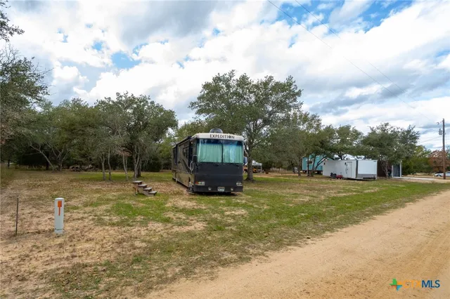 a view of a yard with a house