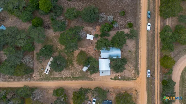 a workspace with wooden floor and windows