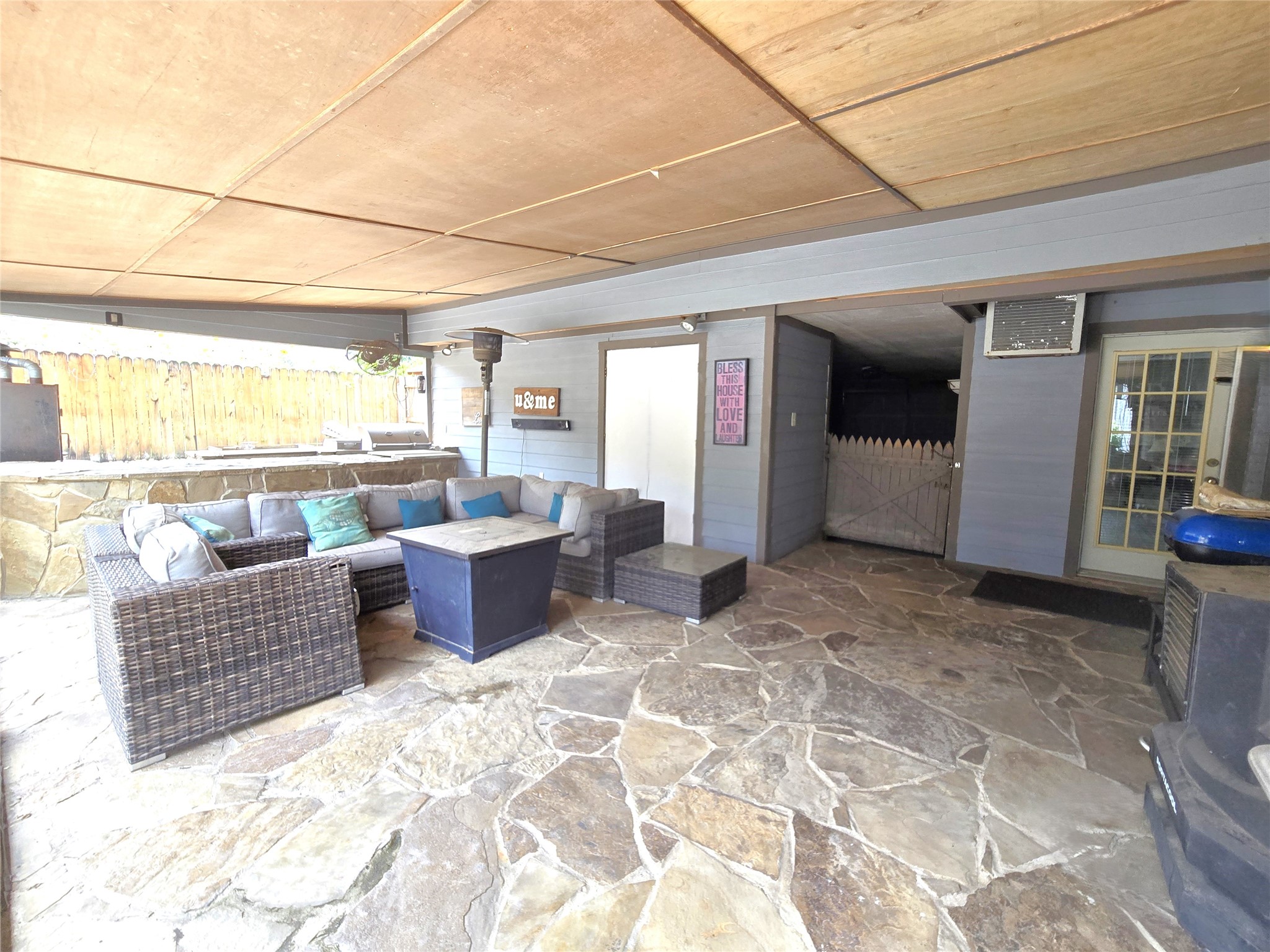 560 Brandon Road Conroe, TX 77302 - Photo 43 of 45 Spacious covered patio with stylish seating, perfect for relaxing or entertaining guests.