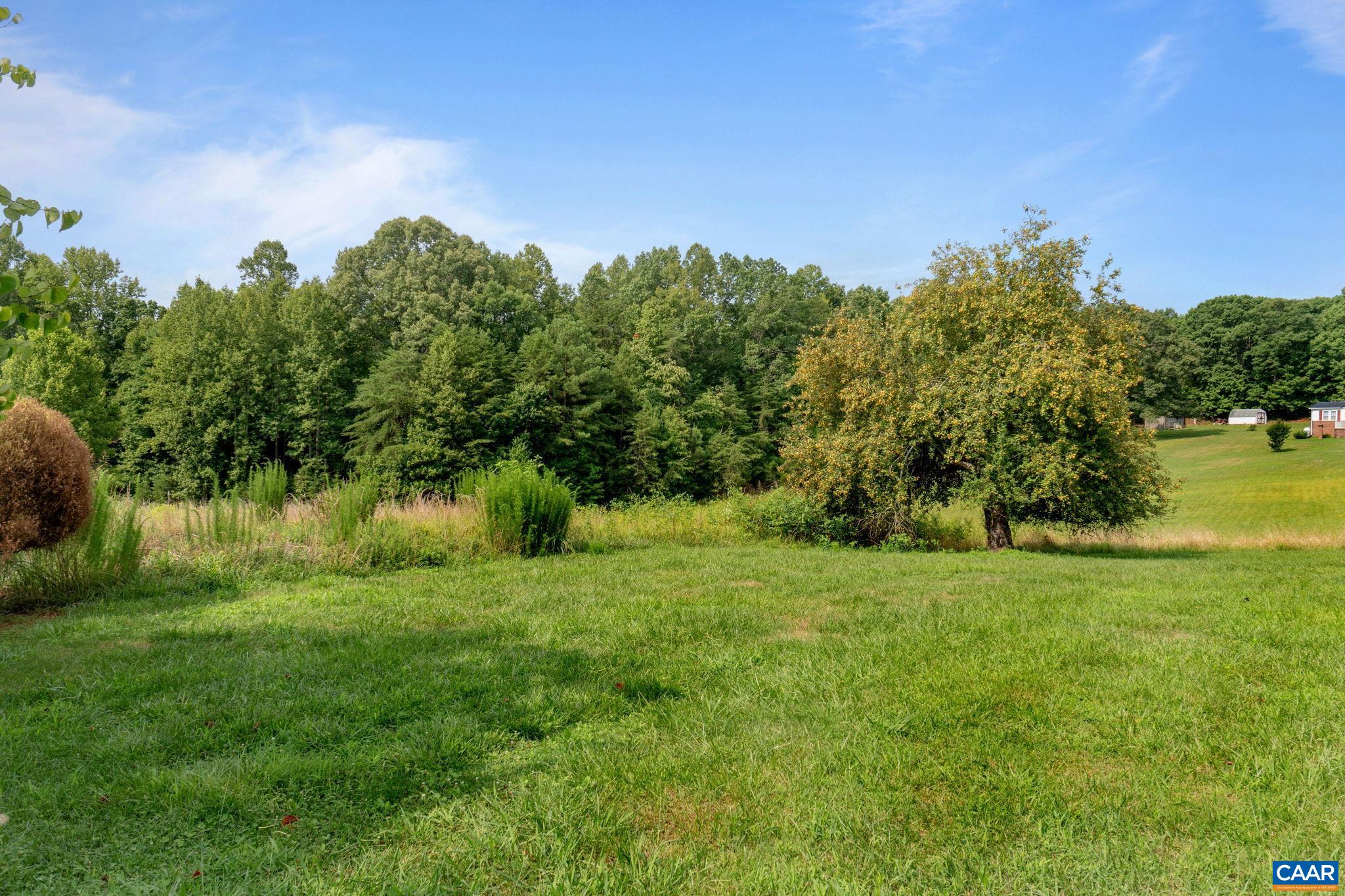 1990 Seven Eleven Road Cumberland, VA 23040 - Photo 20 of 21 a view of grassy field with trees in the background