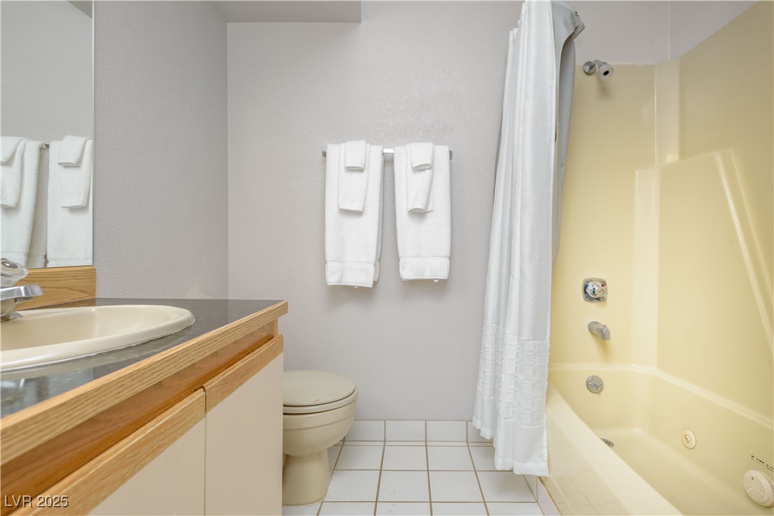 223 Hunter Ridge Drive, Unit 2303 Brian Head, UT 84719 - Photo 13 of 31 Bathroom featuring light tile patterned floors, shower / tub combo, and vanity