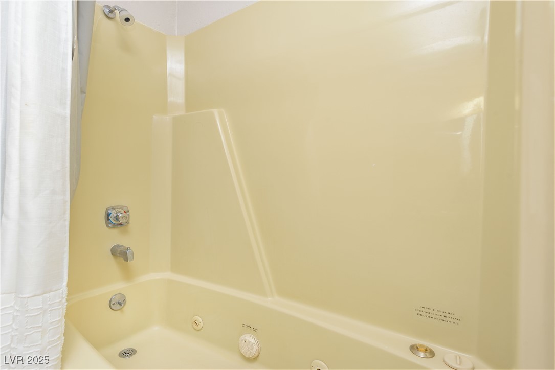 223 Hunter Ridge Drive, Unit 2303 Brian Head, UT 84719 - Photo 14 of 31 Bathroom featuring a combined bath / shower with jetted tub