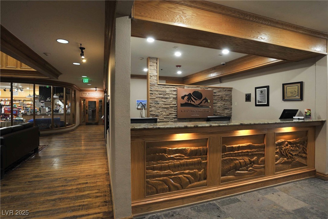 223 Hunter Ridge Drive, Unit 2303 Brian Head, UT 84719 - Photo 21 of 31 Reception featuring a dry bar, ornamental molding, and recessed lighting