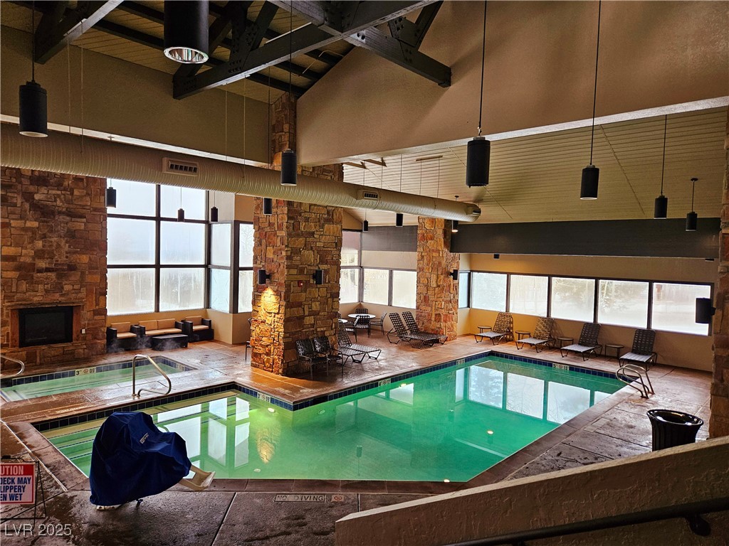 223 Hunter Ridge Drive, Unit 2303 Brian Head, UT 84719 - Photo 24 of 31 Indoor community pool with a sunroom