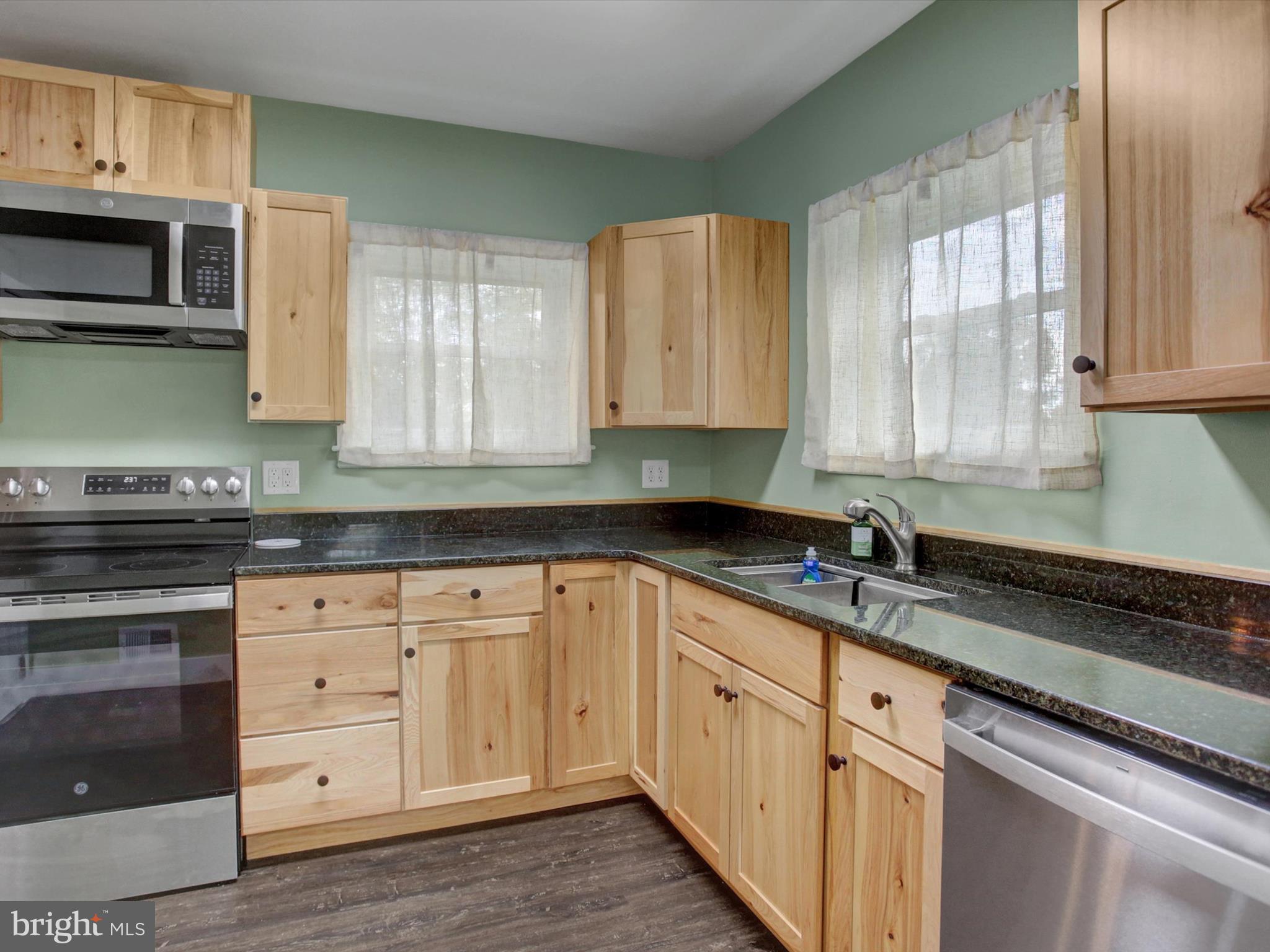 3043 Emmitsburg Road Gettysburg, PA 17325 - Photo 12 of 48 a kitchen with granite countertop white cabinets stainless steel appliances and a sink