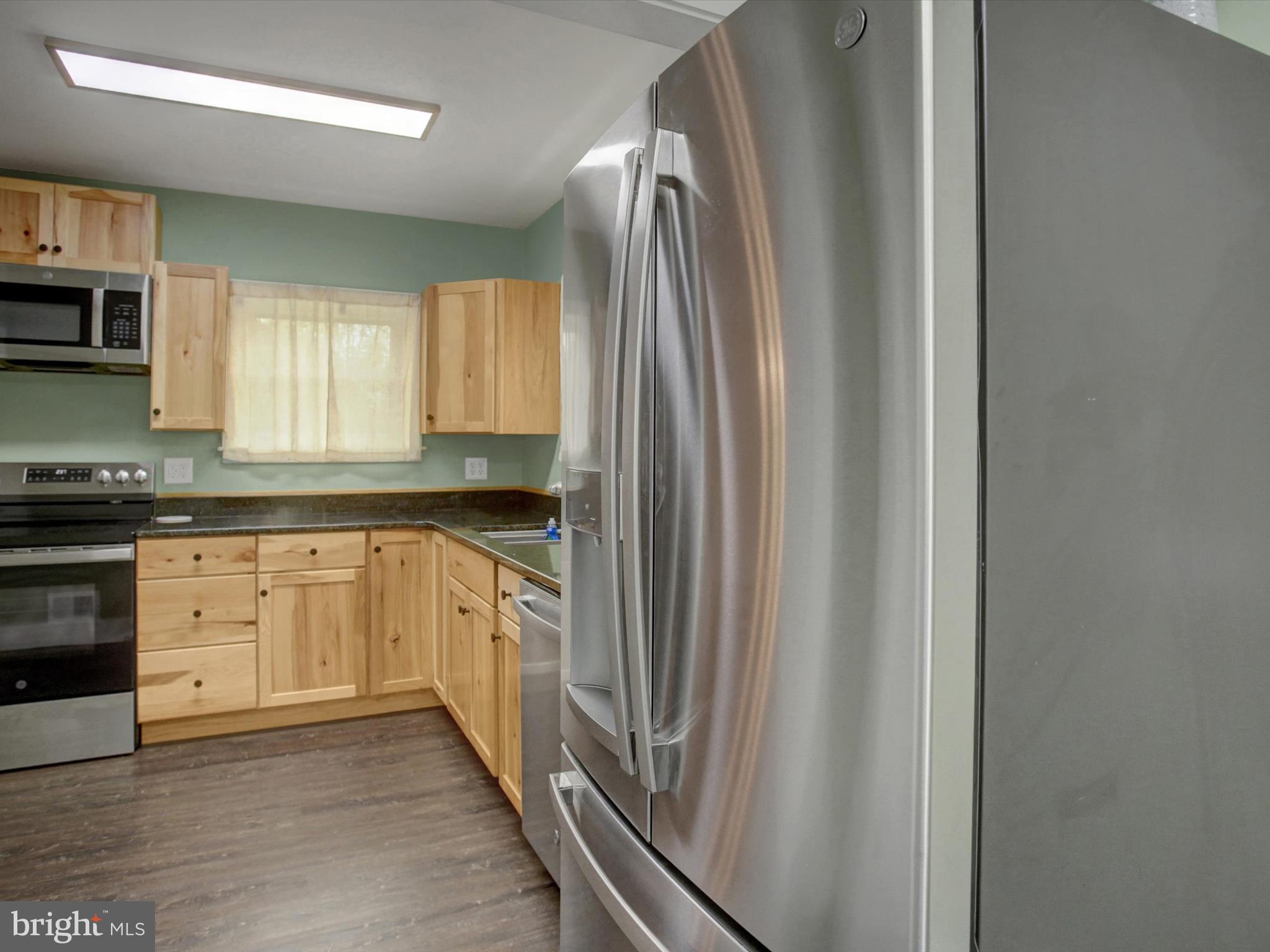 3043 Emmitsburg Road Gettysburg, PA 17325 - Photo 13 of 48 a kitchen with granite countertop a refrigerator sink and stove