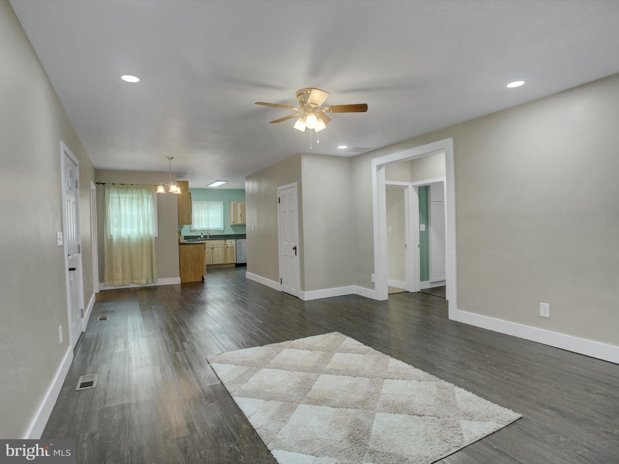 3043 Emmitsburg Road Gettysburg, PA 17325 - Photo 18 of 48 an empty room with wooden floor and a chandelier fan