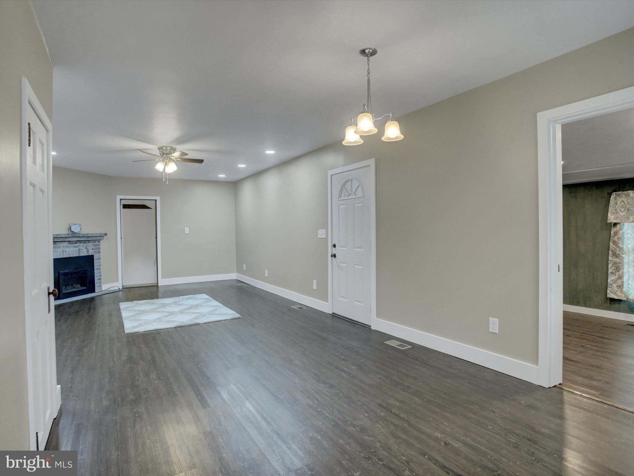 3043 Emmitsburg Road Gettysburg, PA 17325 - Photo 19 of 48 a view of an empty room and wooden floor kitchen view and a window