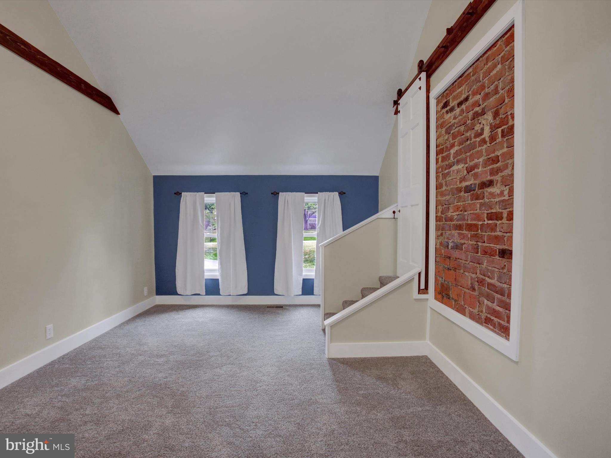 3043 Emmitsburg Road Gettysburg, PA 17325 - Photo 25 of 48 a view of an empty room with window and stairs