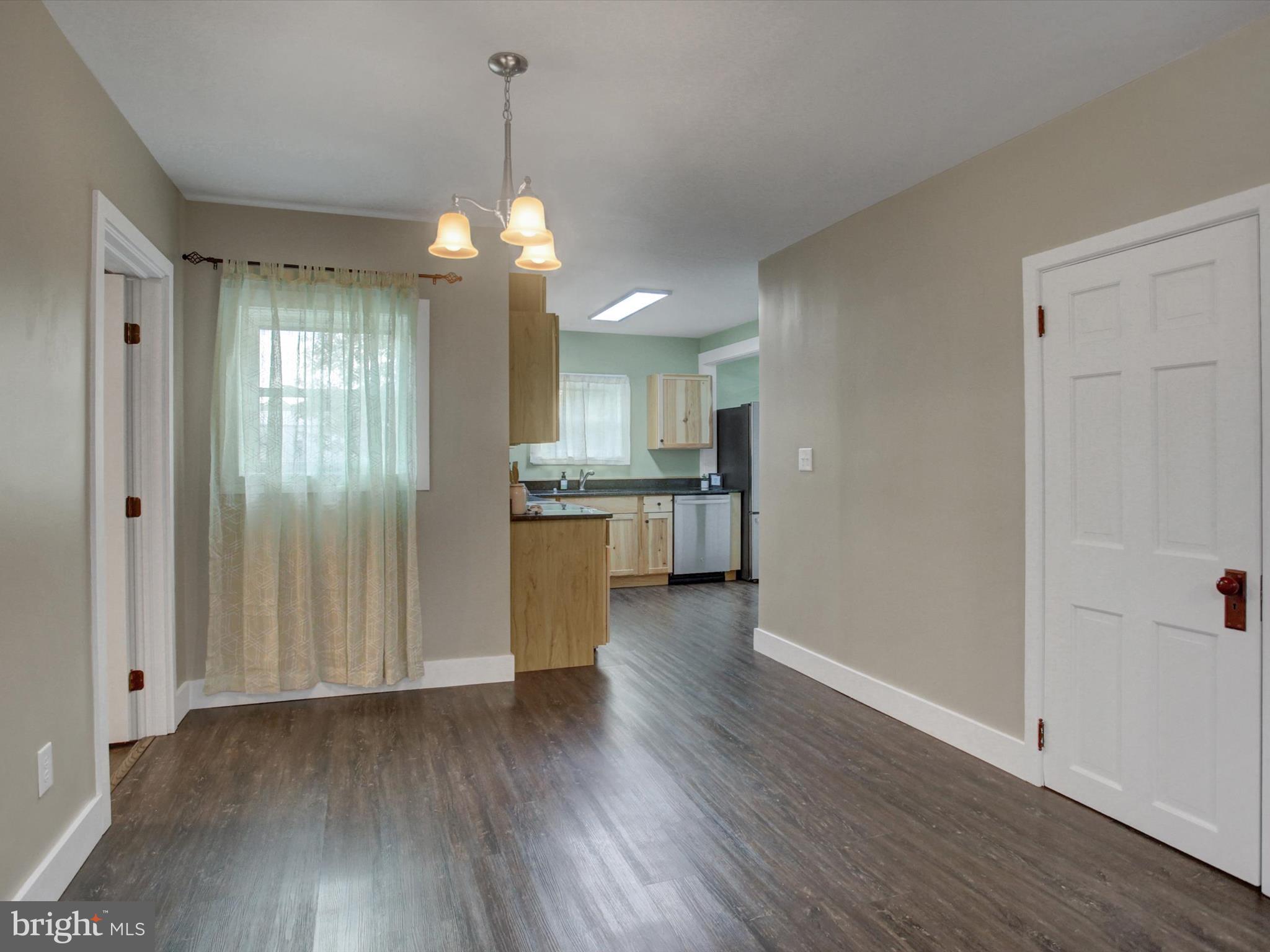 3043 Emmitsburg Road Gettysburg, PA 17325 - Photo 8 of 48 a view of a kitchen with a dishwasher cabinets and wooden floor