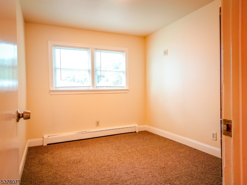 104 Eastern Way, Unit 2 Rutherford, NJ 07070 - Photo 14 of 18 an empty room with a window