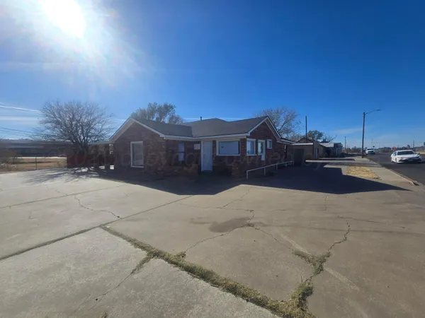 a view of a house with a street