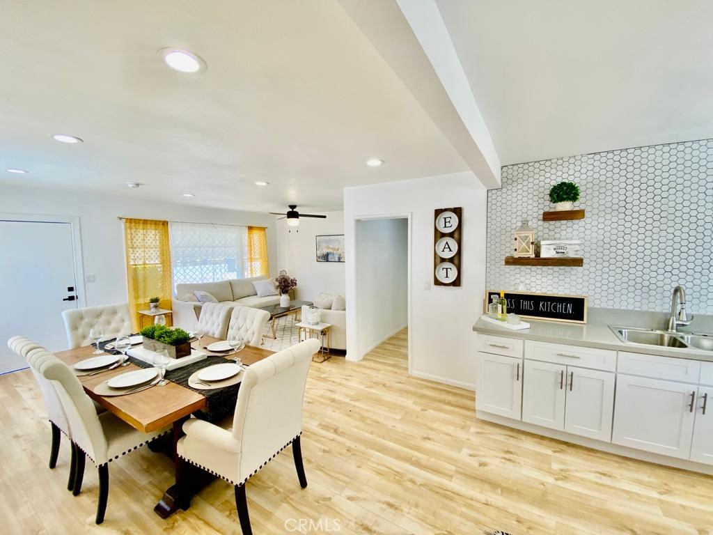 9465 Garfield Street Riverside, CA 92503 - Photo 1 of 1 a living room with furniture and wooden floor