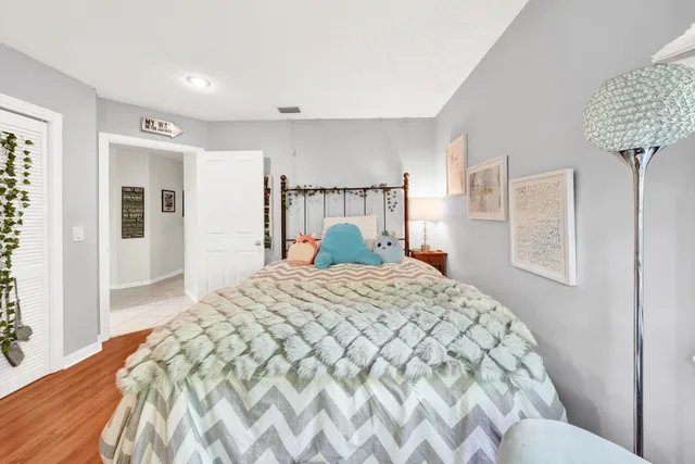 a bedroom with a large bed and a window